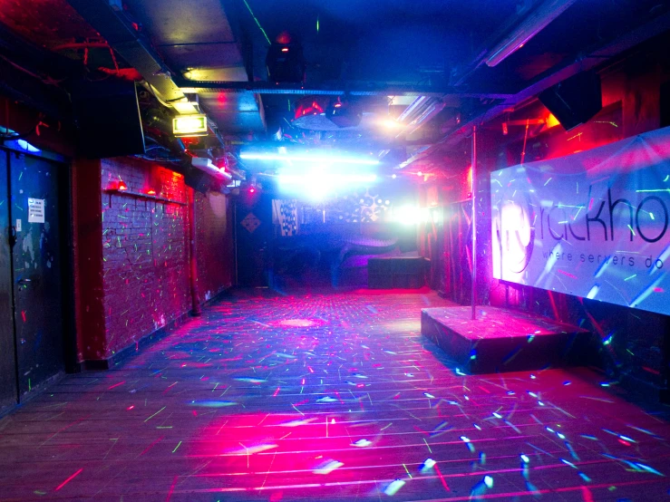 disco lights shine brightly through a dark room