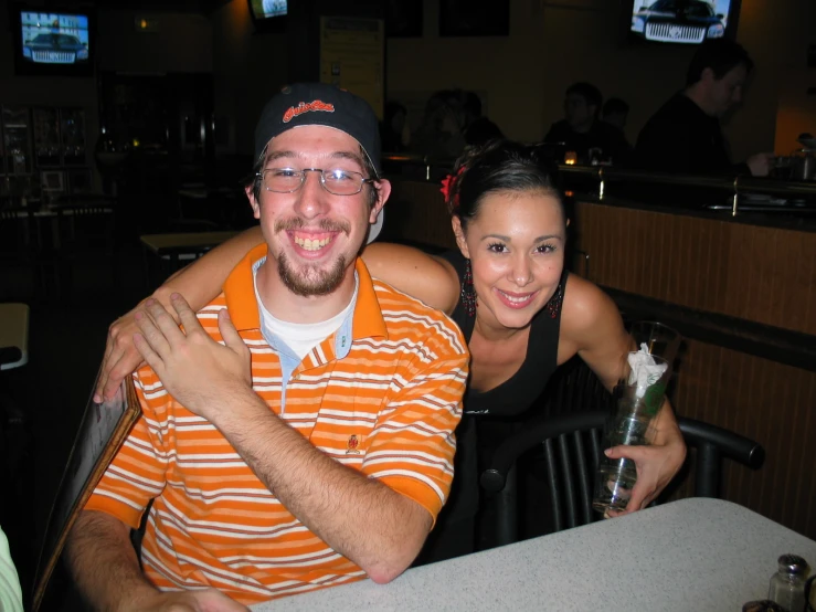 a man holding a woman at a restaurant