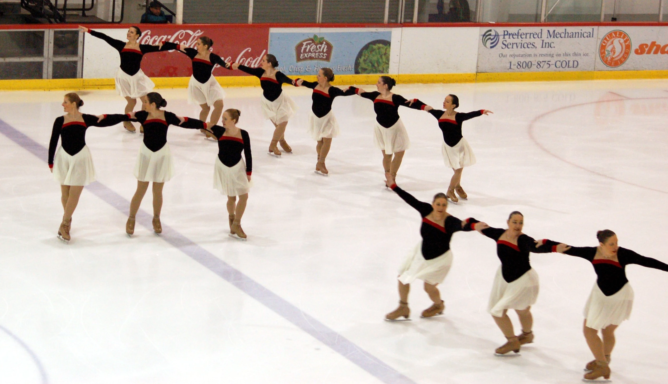 several people that are performing in the snow