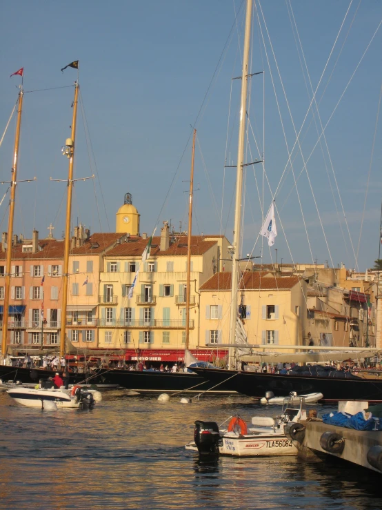 an image of a city with boats floating on the water