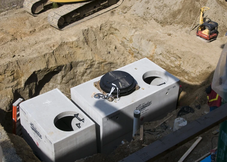 two concrete blocks are placed on top of the ground