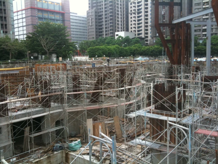 several steel structure sitting at the edge of some buildings