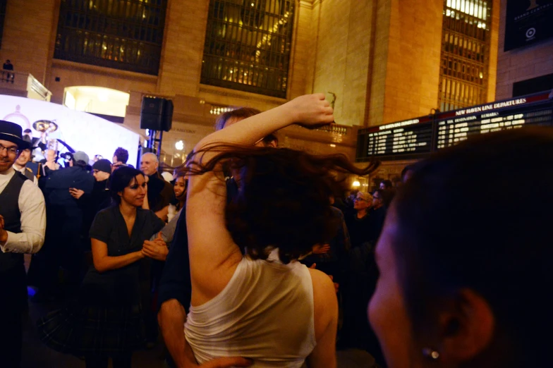 crowd of people in city street on cellphones