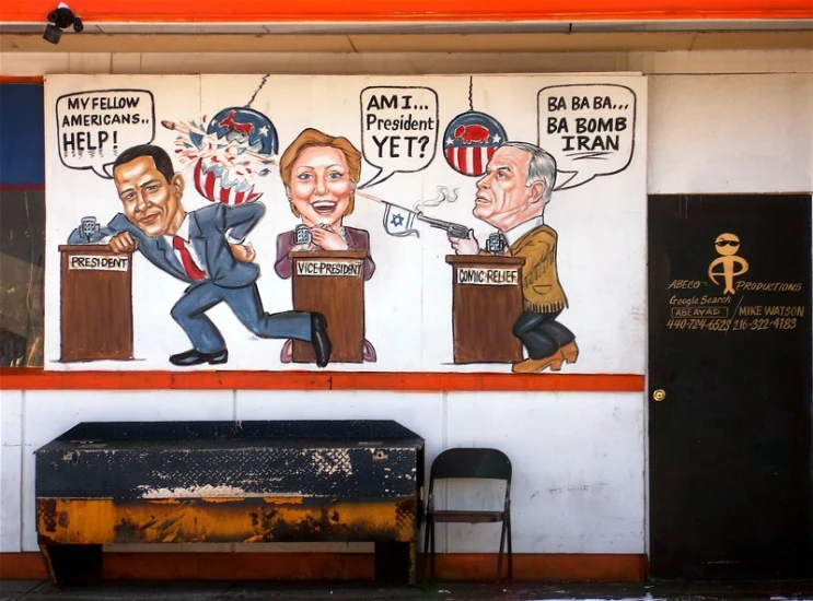 a wall with political cartoon murals on it's side
