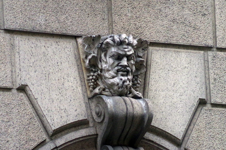 a sculpture of a bearded man with curly hair