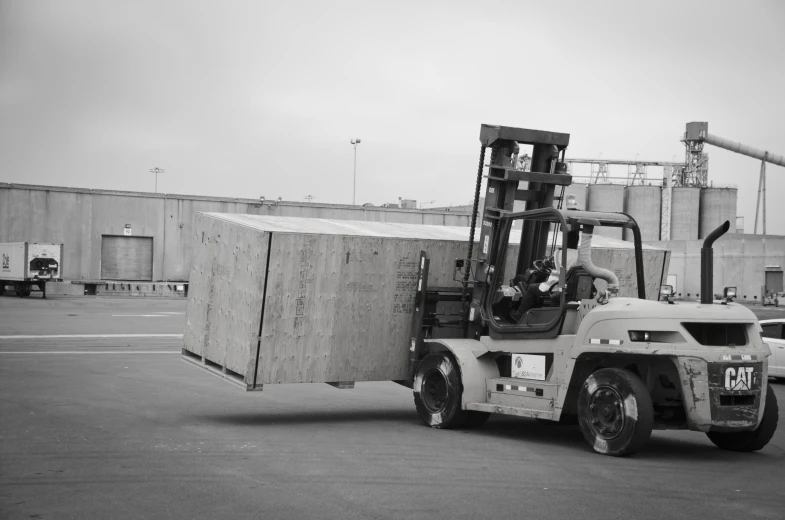 a man is riding on top of a forklift