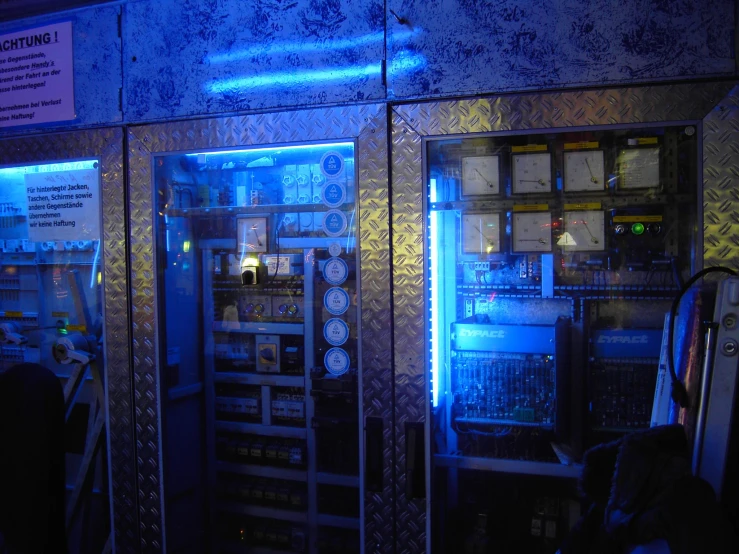 a vending machine with neon lights inside of it