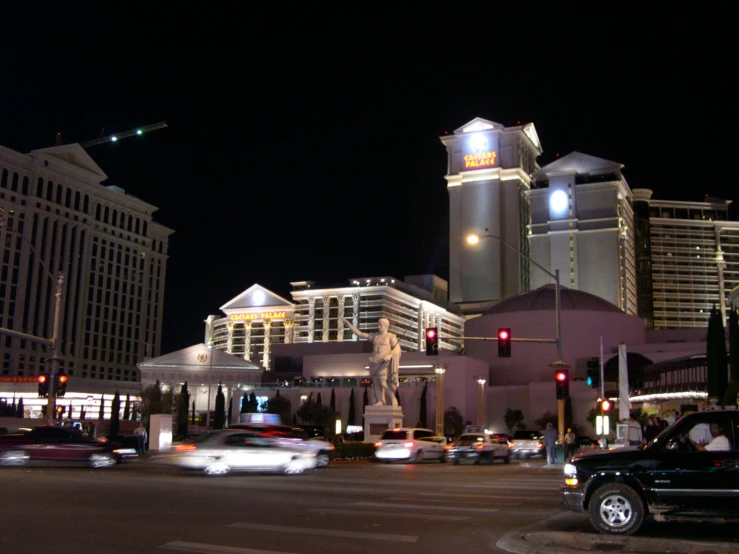 a street at night with some tall buildings