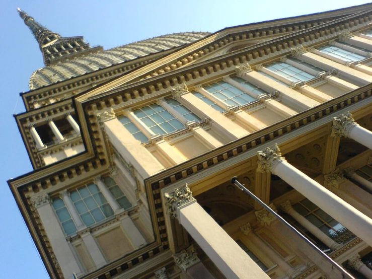 an old building with very tall pillars and windows