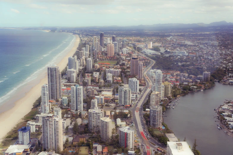 an aerial view of the beach in the city