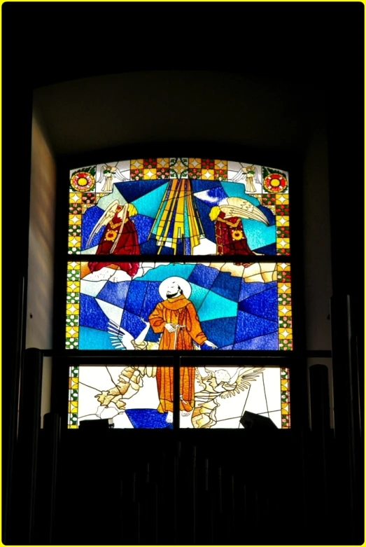 the stained glass window has three different designs