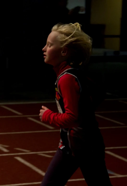 the young woman is running across the floor