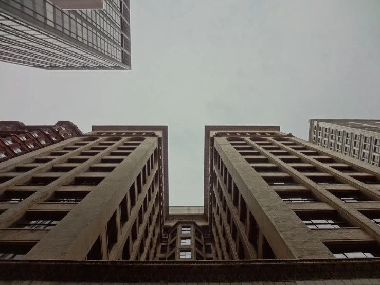 the view of tall skyscrs from outside the buildings