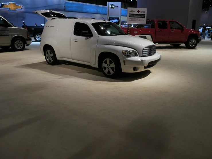 there is a white truck on display in a showroom