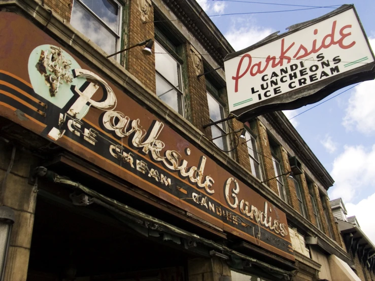 a building with large sign for porkside in front of it