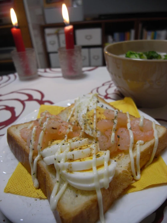 a meal that has bread with cream and fish