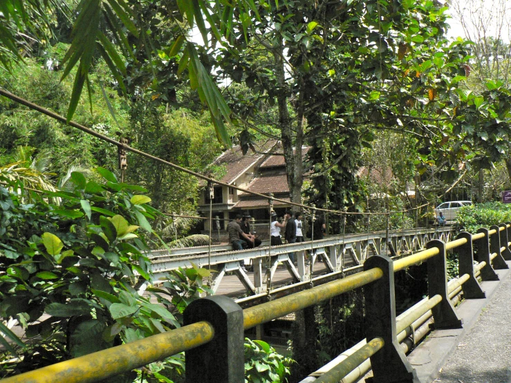 a bridge with some people standing on the one side