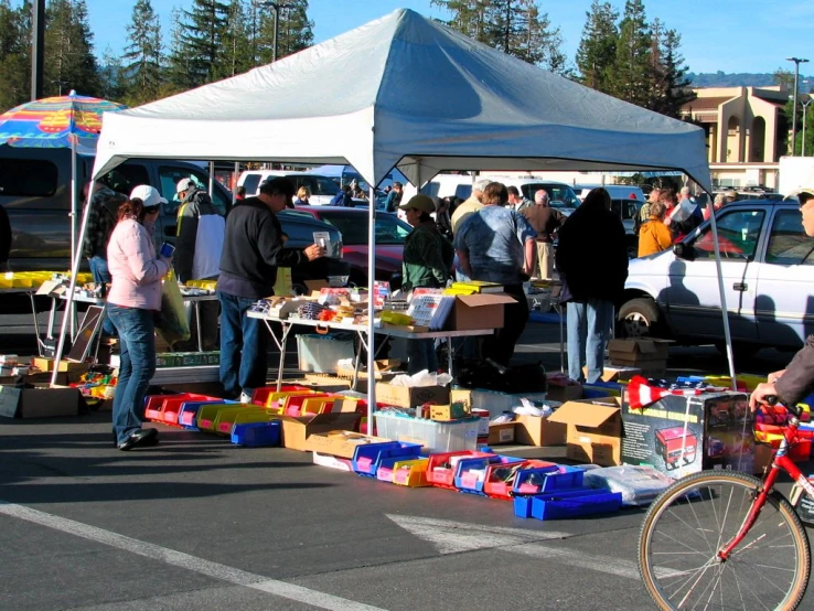 people gather at a fair for food on the street