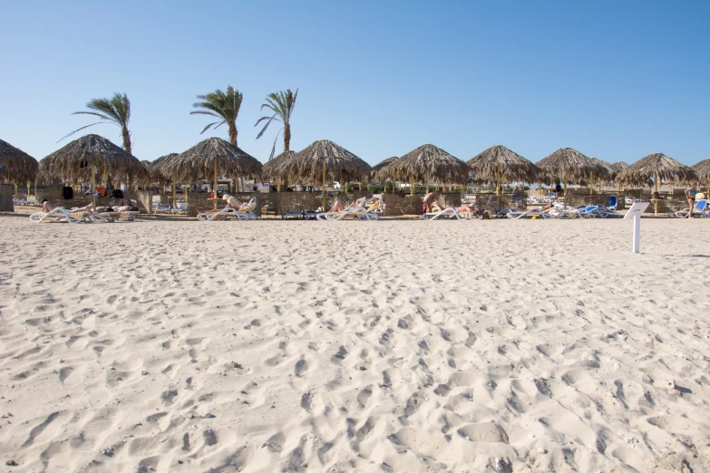 the sand and grass is very white and sandy