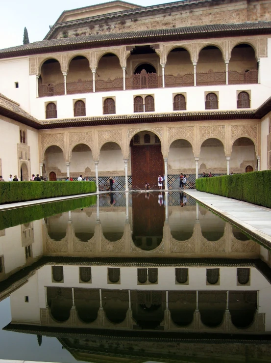 a large room with water and two doors