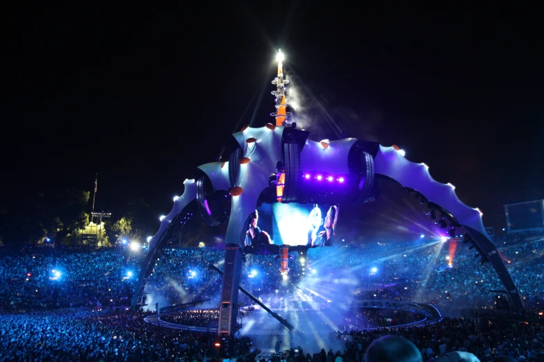 a giant robot in front of an outdoor audience