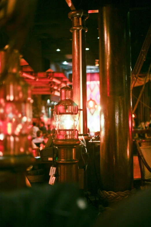 red lanterns are lit in a restaurant with red lights