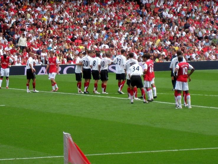 a group of men in soccer uniforms during a game