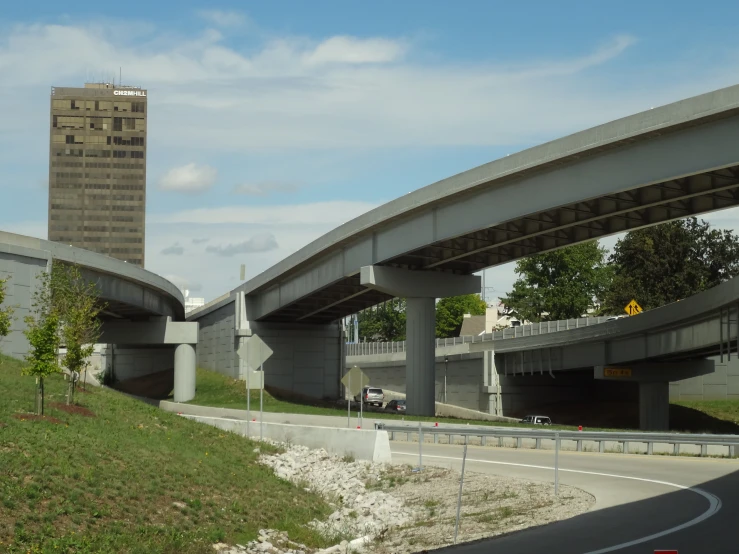 a building over a freeway with an overpass