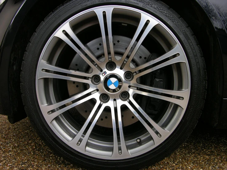 the spokes and wheel tires on a car are seen