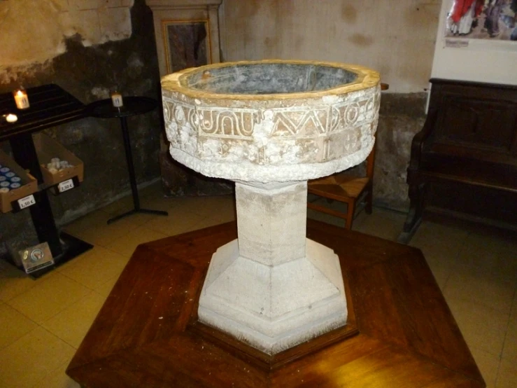 a marble bowl on display in the center of a room