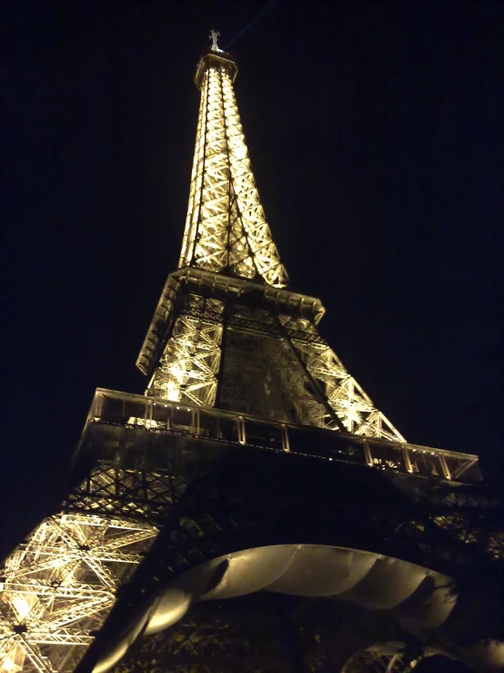 eiffel tower lit up at night in france