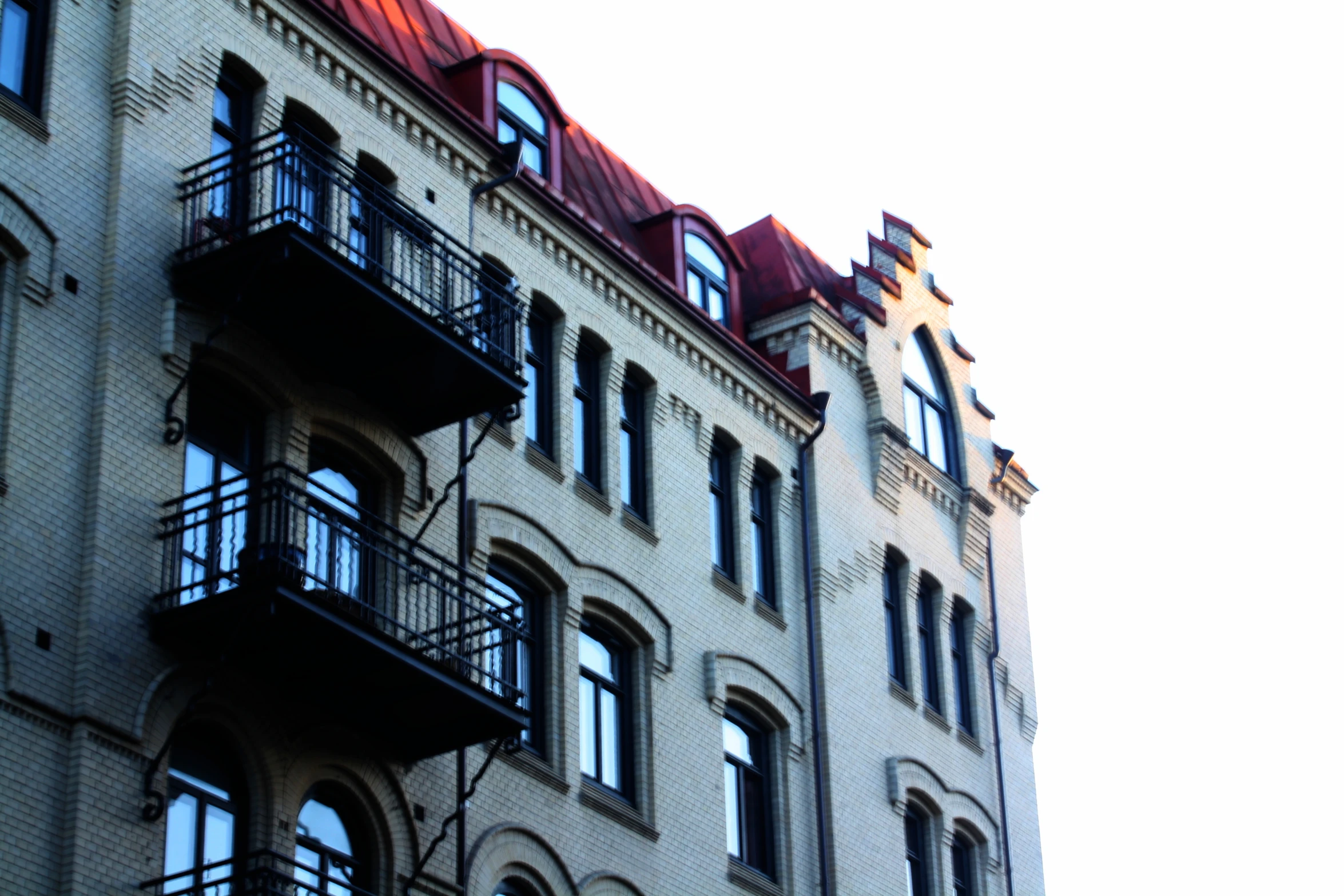 a brick building with lots of windows on top