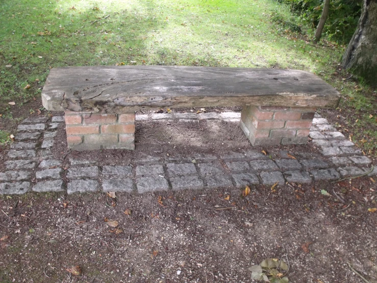 the bench is made of bricks in the garden