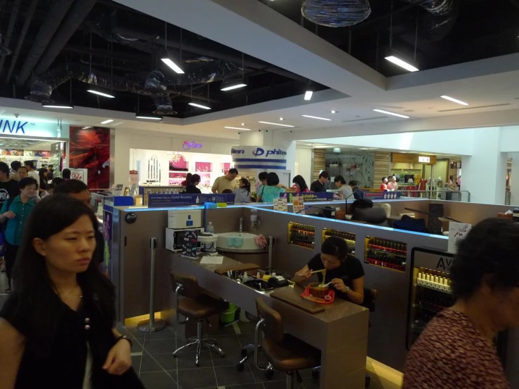 a group of people eating food from trays