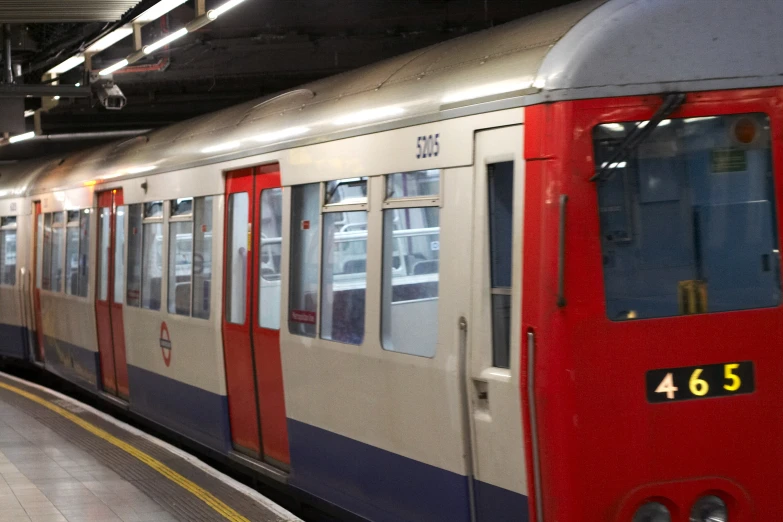 a train parked in a station with doors open