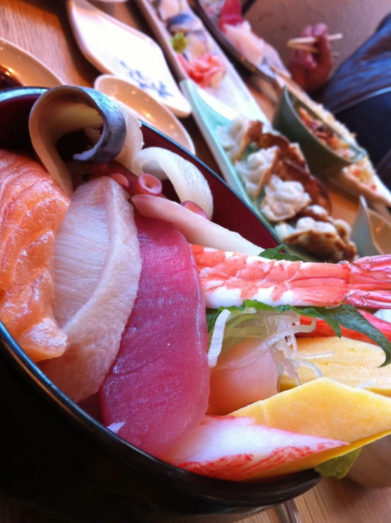 a plate with assorted seafoods sitting on top of it