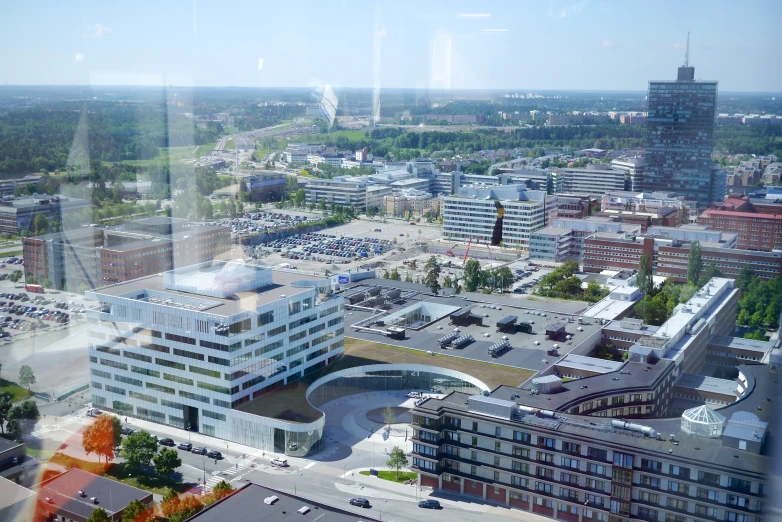 a city view through the window looking down at buildings