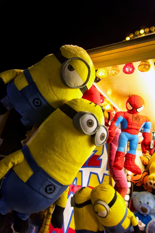 a group of stuffed animals are all standing in front of a building