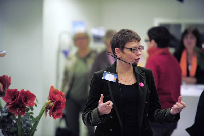 an attractive woman with glasses speaking into her cell phone