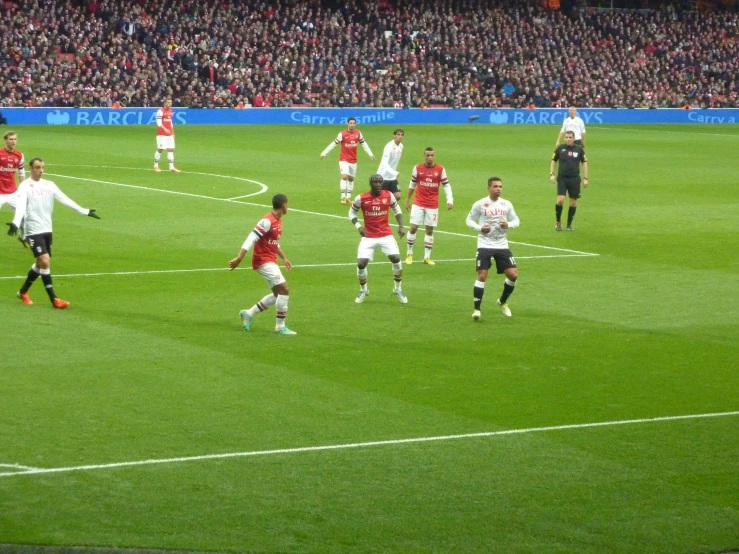 a soccer field with players playing on it