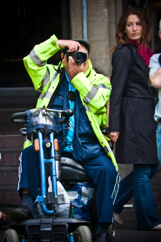 a man wearing a safety vest on a motorcycle