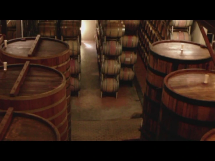the wooden barrels are sitting next to each other