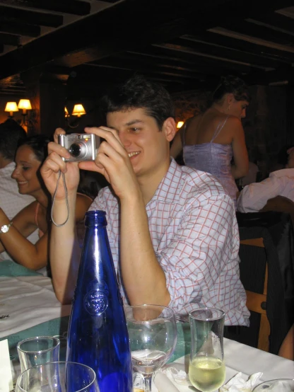 a man taking a pograph with his camera