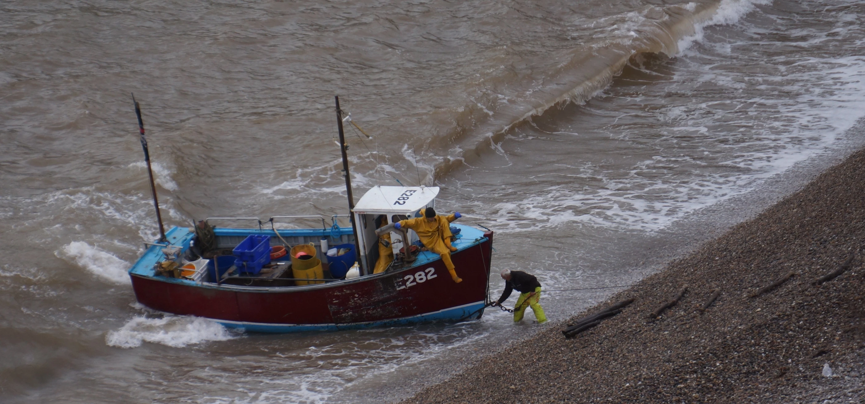 a small boat that is next to the shore