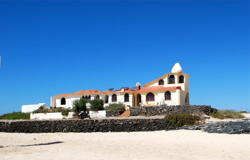 there is a house built on top of the rocks