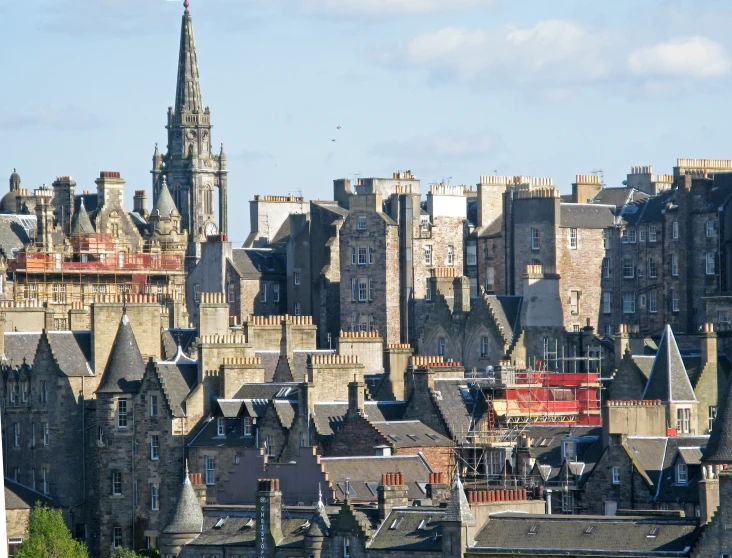 old buildings sit along the edge of a river in scotland