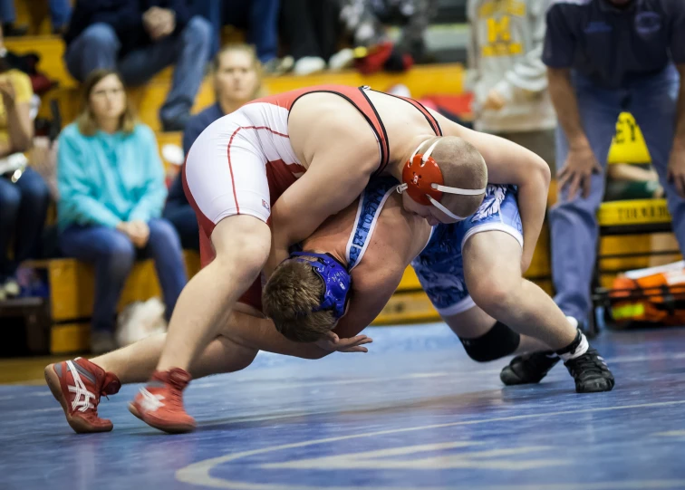 two wrestling wrestlers are in position for the next match