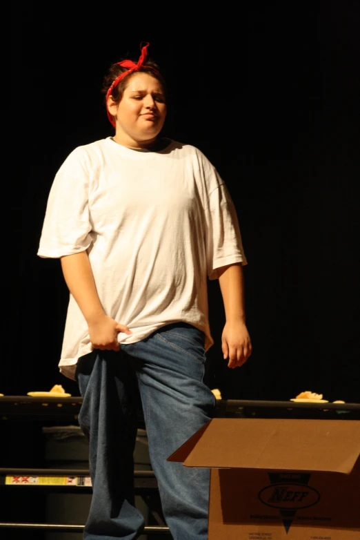 a man is standing on a skateboard at a competition