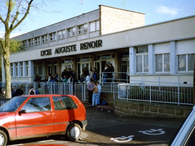 a group of people standing in front of a restaurant