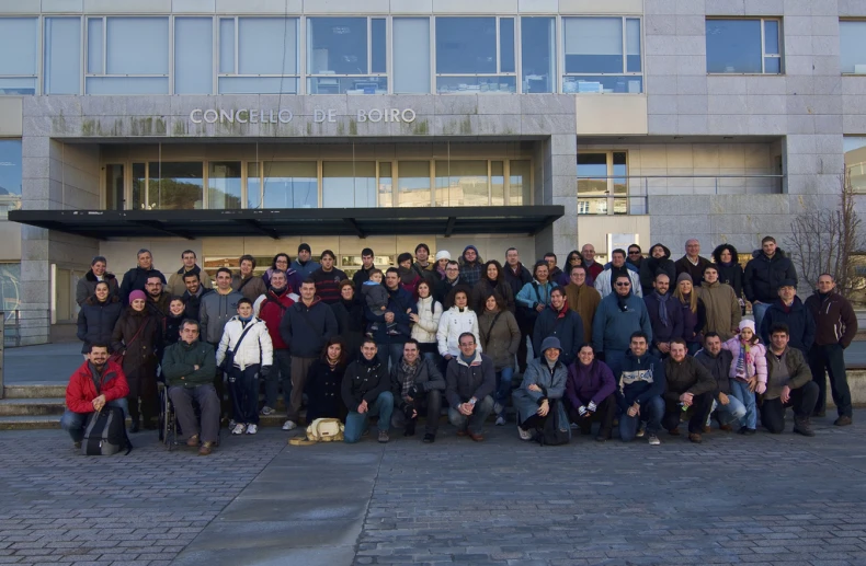 a group of people gathered outside of a building